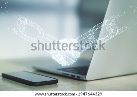Creative concept of blockchain technology with handshake on modern laptop background. digital money transfers and decentralization concept. Multiexposure
