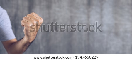 Male clenched fist with copy space for banner background