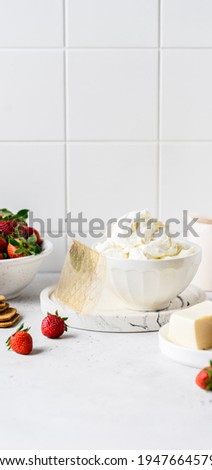No Bake Strawberry Cheesecake Ingredients: Butter and Crackers for the Crust, Cream Cheese, Cream, Gelatin and Strawberries for the Filling, banner, copy space for your text