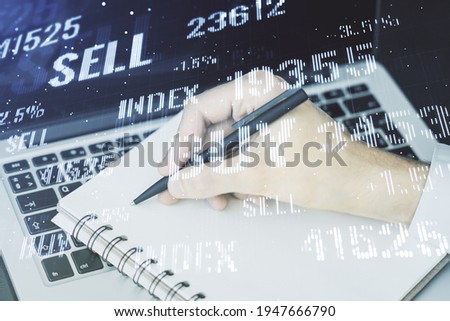Multi exposure of abstract creative financial graph with hand writing in notepad on background, forex and investment concept
