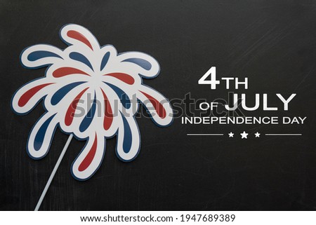 Firework props on blackboard with the text 4th of July,Independence day