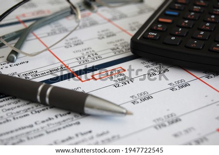An overview of a financial financial year end budget portfolio report. Royalty-Free Stock Photo #1947722545