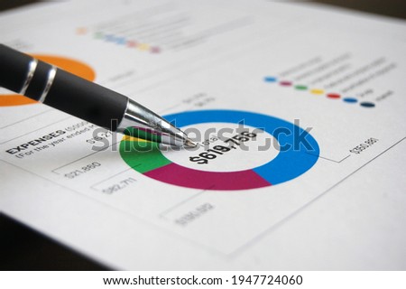 An overview of a financial diagram year end investment portfolio report. Royalty-Free Stock Photo #1947724060