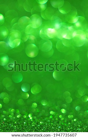 Abstract green glitter bokeh on blur background