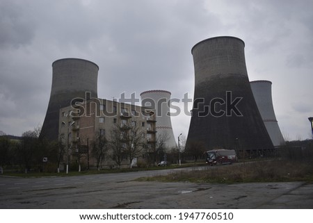 Power plant or Chemical plant in a cloudy day. Thermal station in Romania. Termocentrala Rovinari in Rovinari City, Gorj County, Romania - 01.04.2021
