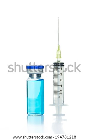 Syringe and blue ampule isolated on white background