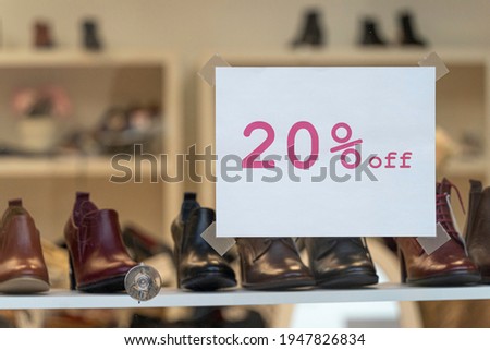 Shoes for sale on display in shop window