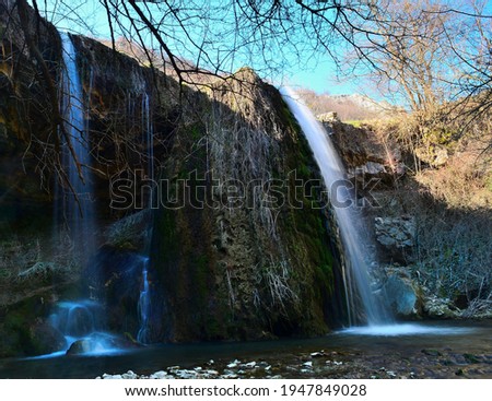 The waterfall of Reselets, Bulgaria. Waterfall at fairytale forest. Water drapery faling into river. Selective focus.