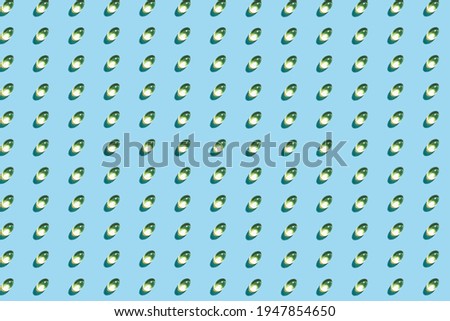 Omega-3 tablets pattern on a blue matte background. Healthy life concept, prevention of various diseases. Trendy hard light, dark shadow, flat lay, mockup, template, top view