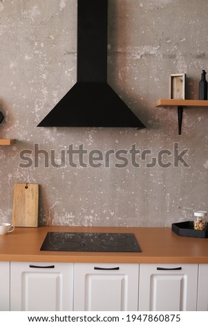 kitchen with gray walls and wooden shelves