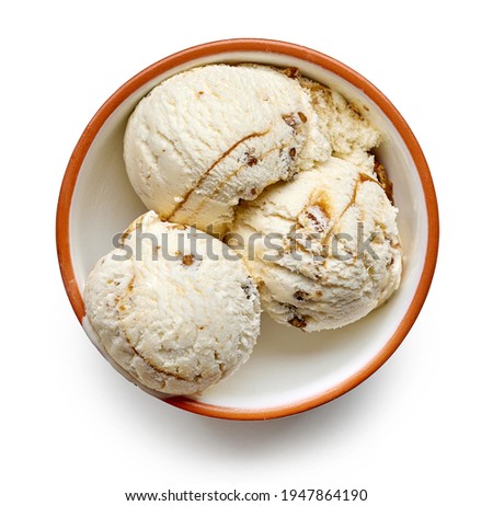 bowl of caramelized walnut and maple syrup ice cream scoops isolated on white background, top view Royalty-Free Stock Photo #1947864190