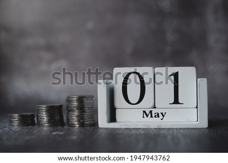 Letter block in word 01 may on black and white background, Working to save money for the future, Laborers wait for the holiday, Labor Day Concept, 