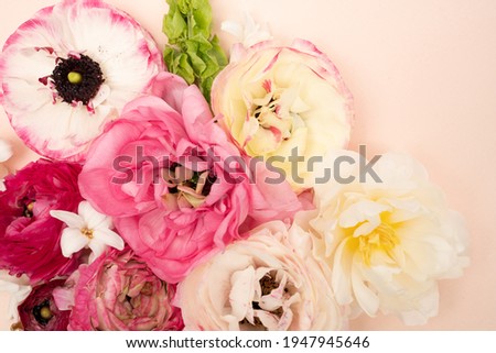 Floral flat lay with fresh ranunculus flowers