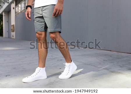 Men's ankle sneakers white street style apparel shoot Royalty-Free Stock Photo #1947949192