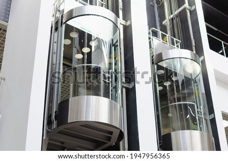 Elevator (capsule lift) in the shopping center. Royalty-Free Stock Photo #1947956365