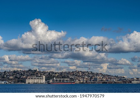 LOWER QUEEN ANNE ON ELLIOTT BAY WITH THE GRAIN TERMINALS AND RADIO TOWERS Royalty-Free Stock Photo #1947970579