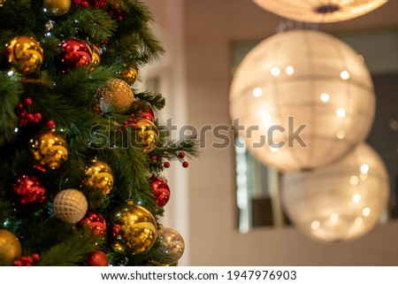 Decorated Christmas tree on blurred