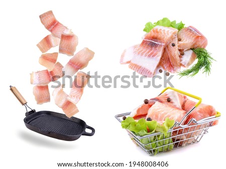 A steak of flying fish falls into the pan. The effect of flying motion in the cooking process.Isolated objects on a white background. Flying food.