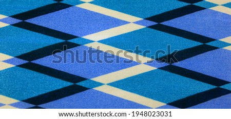 silk fabric with geometric shapes of squares in blue. Simple geometric pattern, small square rapports with a minimalistic airy motif. wallpaper, texture, background.