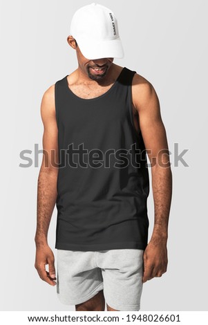 African American man wearing black tank top with white cap Royalty-Free Stock Photo #1948026601