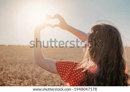 Vitamin D in Womens Health, Role of Vitamin D3 Supplements in female health. Young woman enjoying sun in nature background Royalty-Free Stock Photo #1948047178
