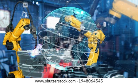 Smart industry robot arms modernization for digital factory technology . Concept of automation manufacturing process of Industry 4.0 or 4th industrial revolution and IOT software control operation .