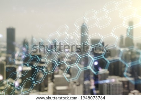 Abstract virtual wireless technology hologram with hexagon on blurry skyscrapers background, artificial intelligence and machine learning concept. Multi exposure