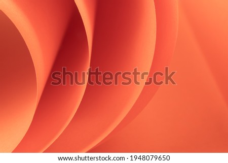 Abstract colored macro background, created with curved color paper sheets and macro photographing. Curved lines and shapes and soft vivid colors.