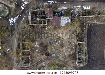 A beautiful sad landscape with old abandoned buildings of the manor complex of the late 19th century. Eastern Europe. Aerial photography