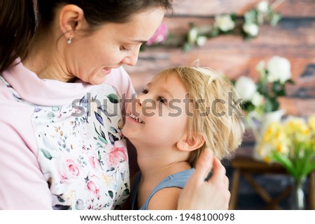 Mother, hugging sweet toddler child, blond boy at home, love and family emotions