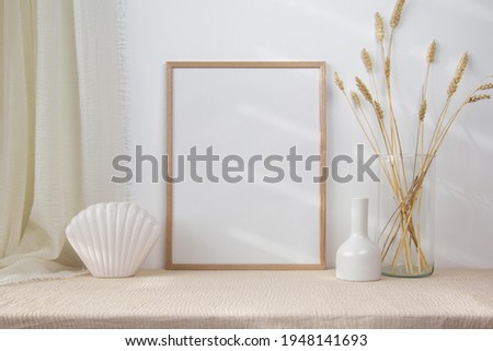 Wooden photo frame mockup with glasses vase