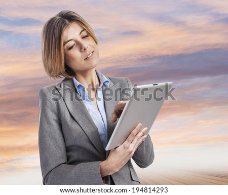 beautiful young business woman using her tablet