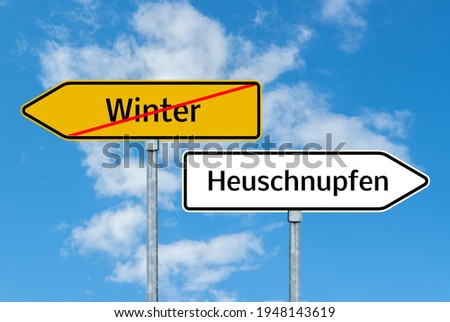 Winter hay fever road sign with blue sky