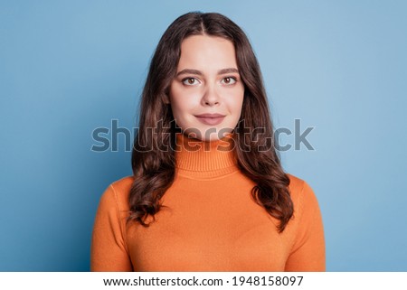 Portrait of dream lovely pretty girl calm look camera isolated on blue background