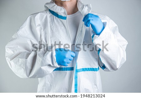 Doctor getting dress up to suit againts corona virus