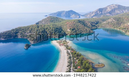 Oludeniz is a small neighbourhood and beach resort in the Fethiye district of Muğla Province, on the Turquoise Coast of southwestern Turkey. It reflects it's beauty wtih it's clear turquoise color.