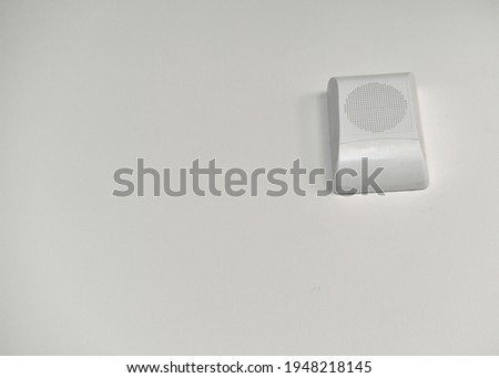 White plastic alarm light on the wall