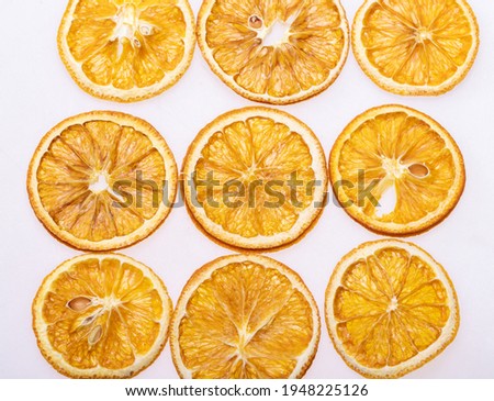 Dried orange slices. Dehydrated crispy fruits for decorating dishes for drinks, desserts and cocktails. 
