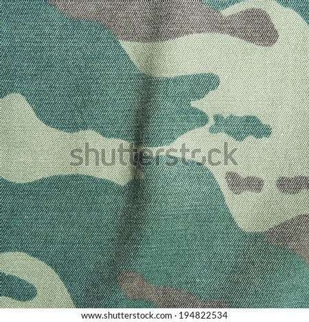 Khaki camouflage texture. Background of a green camo pattern. 