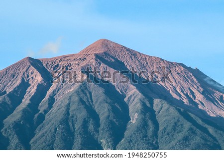 Mount Kerinci is the highest mountain in Sumatra and the highest volcano in Indonesia with an altitude of 3805 masl in the Kerinci Seblat National Park area. Kayu Aro, Kerinci, Jambi, Indonesia, Asia Royalty-Free Stock Photo #1948250755