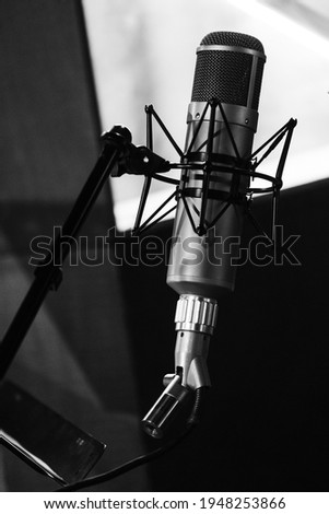  Vocal microphone on a stand in the recording studio. High contrast. Close up