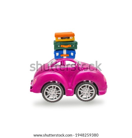 A car with a stack of suitcases, luggage on the roof
