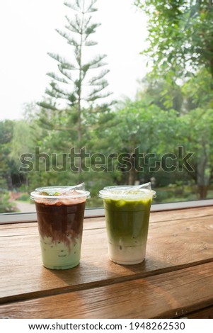 Glass of green iced sweet milk drink, stock photo