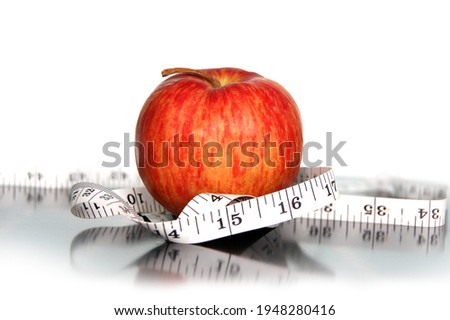 A red apple symbolizing good health and fitness Royalty-Free Stock Photo #1948280416