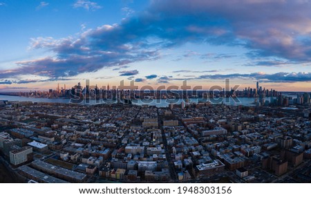 Urban Skyline of Midtown Manhattan, Lower Manhattan, Hoboken and Hudson River at Sunset. New York City, USA.