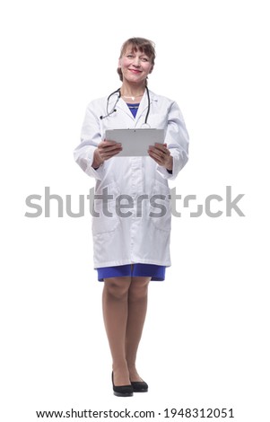 Portrait of woman doctor holding tablet computer, looking at camera, smiling