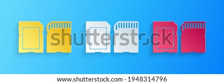 Paper cut SD card icon isolated on blue background. Memory card. Adapter icon. Paper art style.