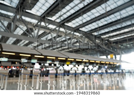 Defocused image of check-in counter almost empty at Airport during in COVID-19 pandemic