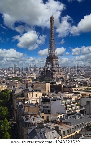 Cityscape and the Eifel Tower in Paris, France, seen from the top of the Arc de Triiomphe Royalty-Free Stock Photo #1948323529
