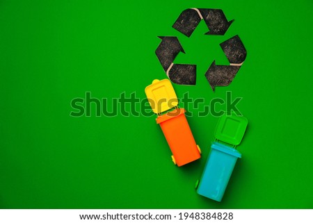 Garbage sorting concept with toy waste bin on paper background